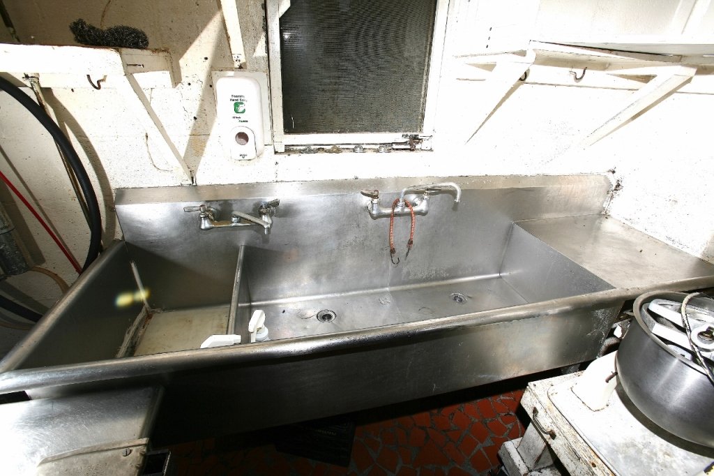 Stainless Steel Two Compartment Sink: 89"W x 28"D.