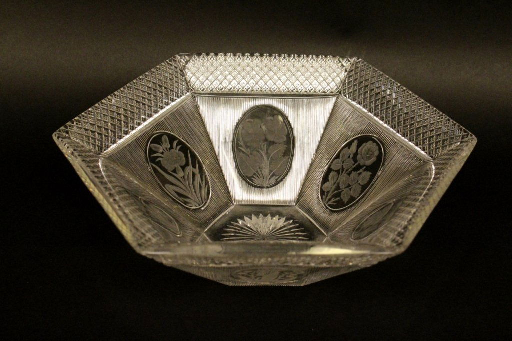 A Rare Six Panel Cut Glass and Intaglio Bowl.: With oval medallions finely decorated with different flowers including roses. Greatest width 10.5 inches.