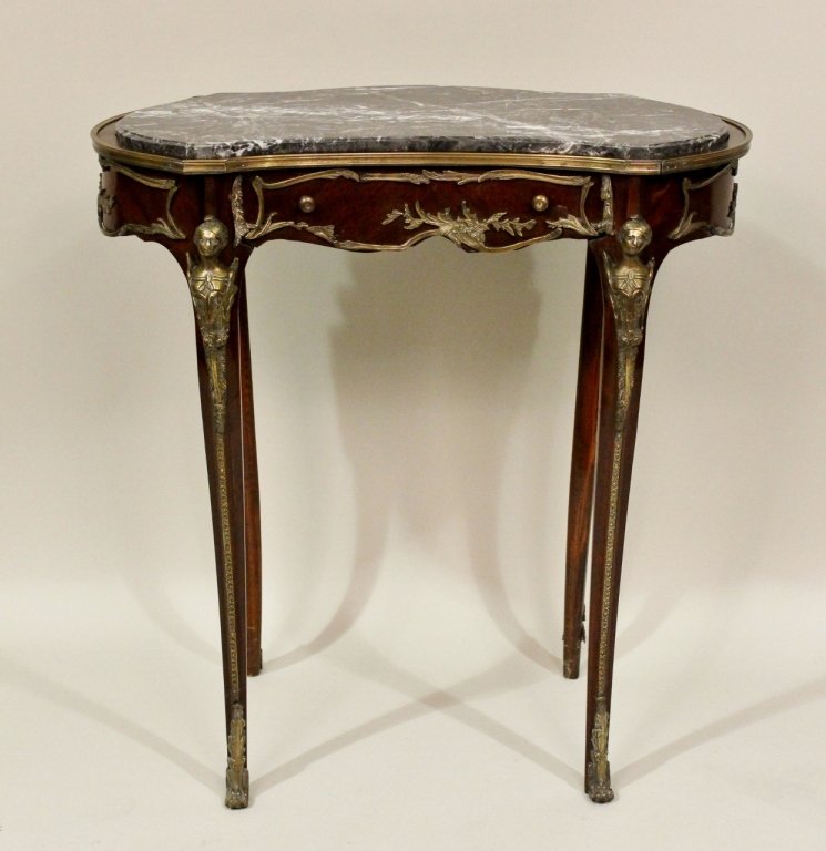 French Bouillotte Dressing Table: Mahogany, one drawer with marble top with bronze ormolu and figural mounts. 30 1/2"H x 28 1/2"W x 16 1/2"D.