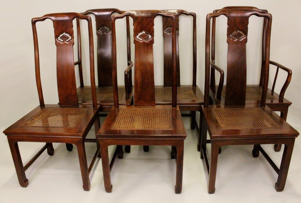 Set of Six Henredon Dining Chairs: Dining chairs in Oriental motif in mahogany wood with pierced decoration on back slat. Each chair with caned seat. Group includes four side chairs and two armchairs. Height 44.25 inches, width 22 inch