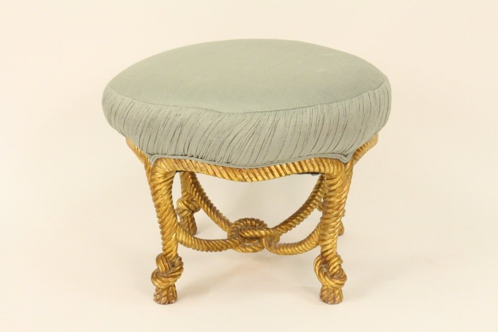 Gilt Wood Framed Ottoman/Vanity Seat: 20th century. Ottoman or vanity seat with pale blue fabric upholstery on rounded cushion raised on gilt wood frame in the shape of knotted rope. Height 19.5 inches, diameter of top 26.5 inches.