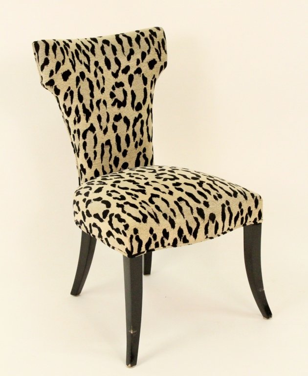 Cream & Black Animal Print Upholstered Side Chair: Contemporary. Cream and black animal print fabric upholstered side chair with flared back raised on four ebonized wood splay legs. Height 35.25 inches, width 20.5 inches, depth 21 inches. Seat to floo