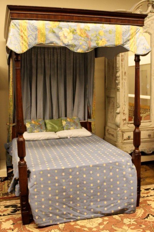 L. 18th/ E. 19th c. American Mahogany Poster Bed: Federal style with molded mahogany canopy frame, a draped headboard with uncarved posts, the foot board with turned, fluted and flower carved posts - 95 1/2"H x 64"W x 79 1/2"L Provenance: Dorothy Gay