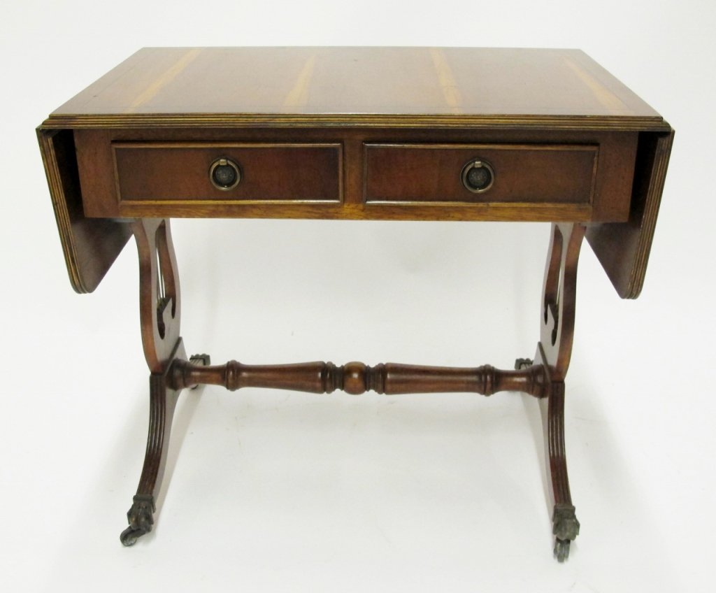 Pine & Mahogany Harp Table: Late 19th/Early 20th century. Accent table with rectangular pine top with two drop leaves above two pull out drawers with circular metal hoop pulls (faux drawer fronts on opposite side). Raised on two