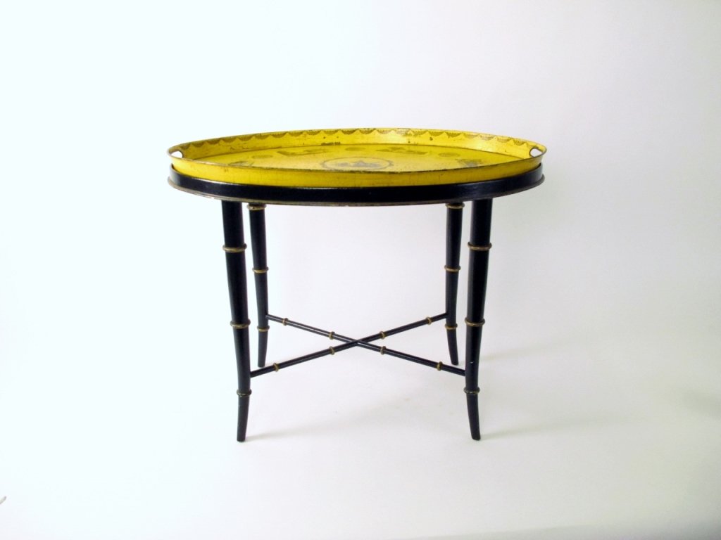Yellow Oval Tray Table: French, 19th century. Tray top table with yellow oval removable metal tray top with antiqued finish decorated with leaves at top rim and architectural sites in border surrounding circular medallion at