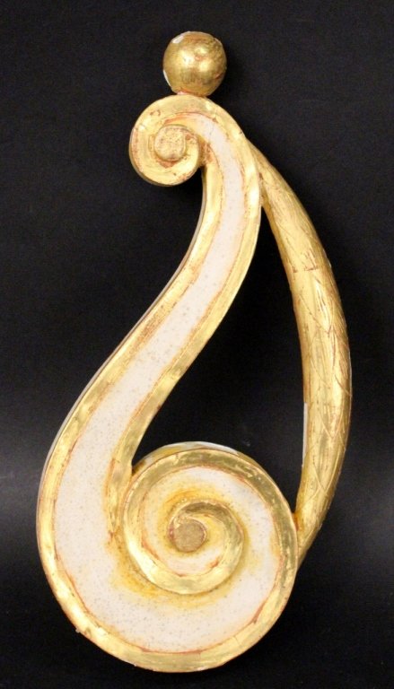 Gilt Wood Architectural Fragment: Likely Italian. Gilt and white painted architectural fragment of scrolled form with ball at end of smaller scrolled tail, leaved flattened arch connecting scrolled end. 14.25 inches x 7 inches x 1.3 i