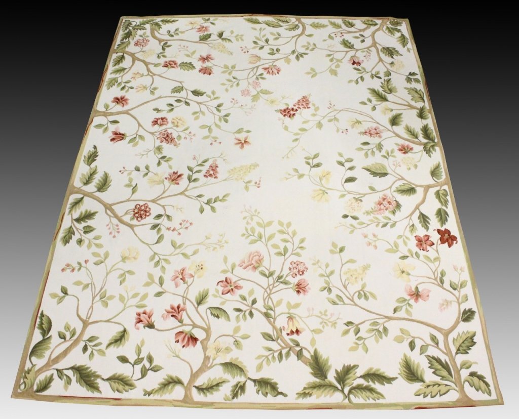 Aubusson Style Floral Tapestry Rug: Chinese, late 20th century. Wool tapestry rug with pink and yellow floral decoration with green leaves attached to brown branch forms on cream colored ground. Border with multicolored organic veining 