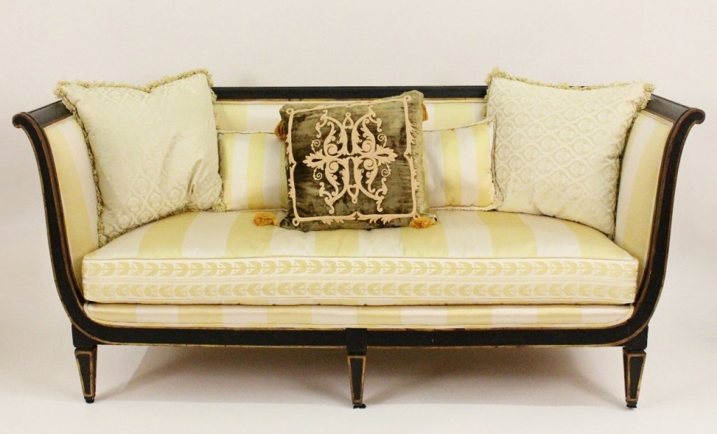 Neoclassical Style Ebonized & Gilt Wood Sofa: 19th century (circa 1820-1830). Sofa of Neoclassical style with black painted wood frame with gilt accent banding. Sofa upholstered in yellow and light cream striped silk fabric upholsery. Rectangular