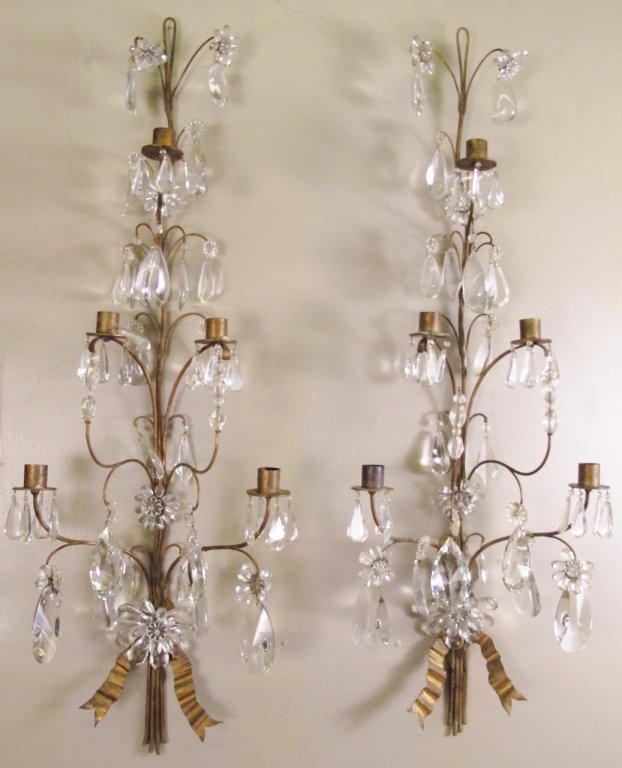 Pair of Iron & Crystal Five Light Wall Sconces: Two matching gilt iron and crystal five candle light wall sconces with crystal floral decoration throughout and metal plant stem form arms with hanging crystals. Ribbon form at bottom. Approximate hei