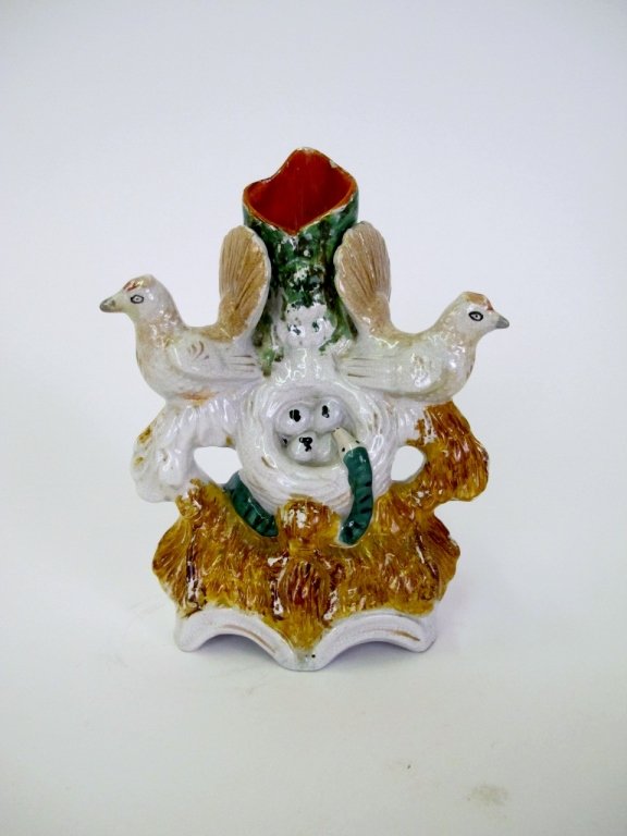 Staffordshire Birds, Nest & Snake Spill Vase, 19th: 19th century (circa 1860). Staffordshire spill vase with two white birds with brown accented heads and tailfeathers perched on tree bracnh form flanking nest with four eggs within as green striped sna