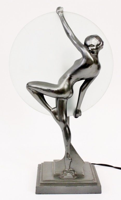 Frankart Figural Nude Silhouette Lamp (L245): Frankart (American 1920s-1930s), No. L245. Original Frankart figural silhouette lamp depicting a young female nude dancer with standing on toes with leg raised and knee bent. Woman holding a frosted g