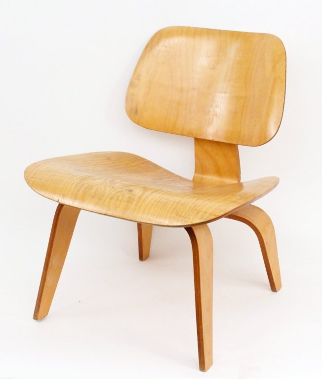 Eames for Herman Miller Wood Lounge Chair: Mid-century modern Charles and Ray Eames for Herman Miller molded plywood lounge chair. Chair with label remnants underneath seat. Height 26.25", width 22", depth 23". Seat to floor 15". Provenance: F
