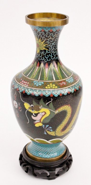Oriental Cloisonne Vase with Dragon: Likely Chinese, 20th century. Oriental cloisonné table vase of traditional footed form with large serpentine dragon in green and yellow with five blue claws on each foot. Dragon on black ground with 