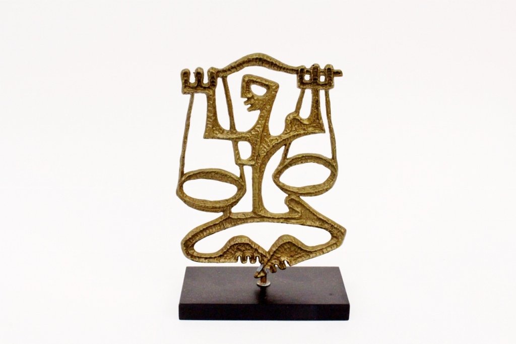 Frederick Weinberg Libra Sculpture: Frederick Weinberg (American, 20th century). Brass metal zodiac table sculpture depicting Libra holding a scale with two hands. Apparently unsigned. Metal figural modern sculpture raised on a rectangu
