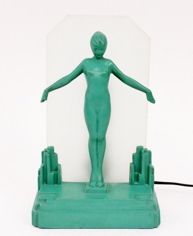 Frankart Figural Nude Lamp (L212): Frankart (American 1920s-1930s), No. 212. Original Frankart figural silhouette lamp depicting a young female nude standing at full length on toes with arms extended in graceful pose in front of a fros