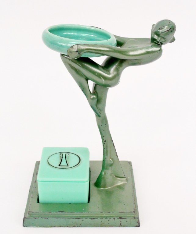 Frankart Figural Smoker's Set (T301X): Frankart (American 1920s-1930s), T301X. Original Frankart figural smoker's set depicting a young female beauty leaning back with knee bent and raised helping to support a circular green ceramic ash tr