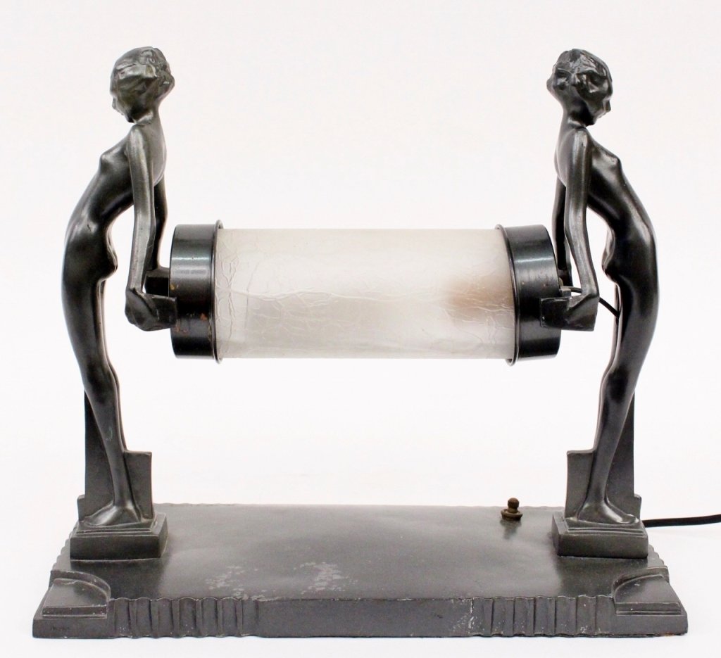 Frankart Figural Lamp (L255): Frankart (American 1920s-1930s), No. L255. Original Frankart figural lamp depicting two young female nudes with backs slightly arched holding a frosted and crackled glass horizontally aligned cylindri