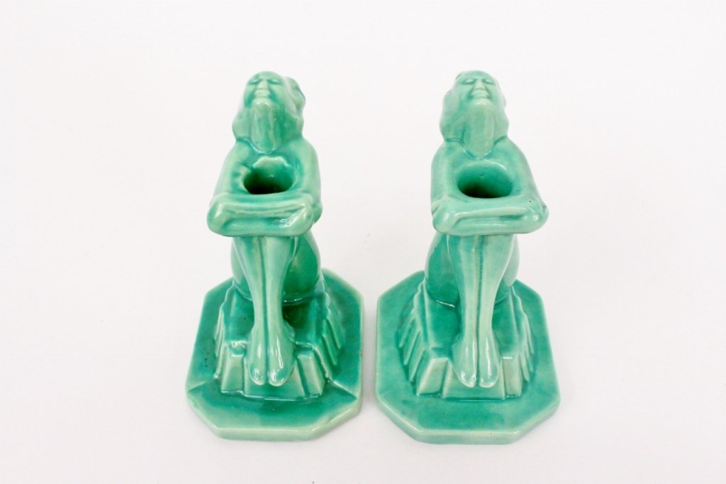 Pair Frankart Ceramic Figural Candlesticks (C106): Frankart (American 1920s-1930s), No. C106. Pair of matching Art Deco figural green glazed ceramic candle holders depicting a seated female nude with knees bent tucked to body by crossed and bent arms