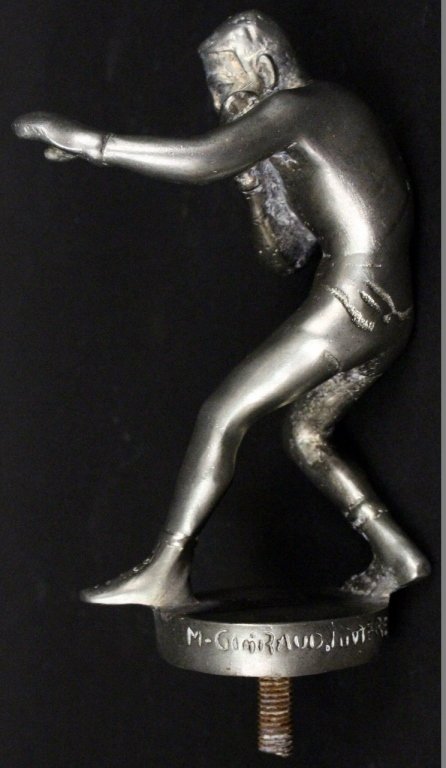 Maurice Guiraud-Riviere Boxer Hood Ornament: Maurice Guiraud-Riviere (French 1881-1947) silver tone metal automobile hood ornament of a male boxer in shorts and gloves in fighting stance. Figure standing on circular base with screw bottom. Signe