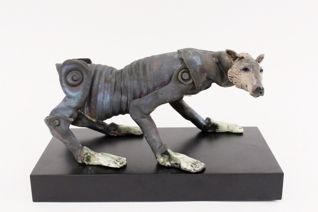 Contemporary Sculptural Work, C. Nelson Grice: Dog form clay sculpture by Alabama artist, C. Nelson Grice (American, Contemporary). Sculptural work depicts a dog represented on all fours with oil can form body with additional industrial style bolt