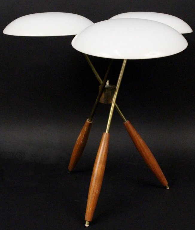 Gerald Thurston Walnut & Brass Table Lamp: Gerald Thurston (American, 20th Century) for Lightolier, table lamp with three walnut wood and brass metal legs below three white metal saucer shades. Each saucer or dish form shade above two electrif