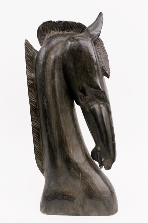 Large Carved Wood Horse with Black Finish: Large carved wood sculptural bust of an elegant horse head in blackened ebonized wood finish. Horse depicted with small ears pointed toward one another with elongated nose and short mane. Apparently u