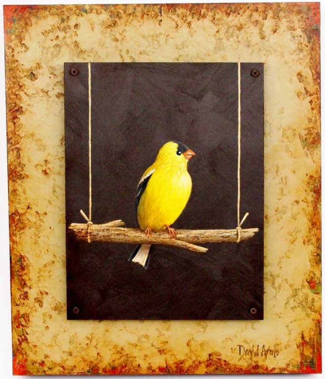 David Arms Contemporary Goldfinch Painting: David Arms (American, Contemporary), "Goldfinch". Oil on wood panel painting of a black and yellow goldfinch bird perched on a brown stick hanging from two pieces of string on a black background. Pain