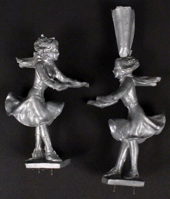Two Cast Metal Frankart Figures, Possibly Samples: Frankart (American 1920s-1930s). Two small cast metal figural sculptures, possibly samples for salesman or company or indended for molds. Each depicting a young woman walking in the wind with scarf bl