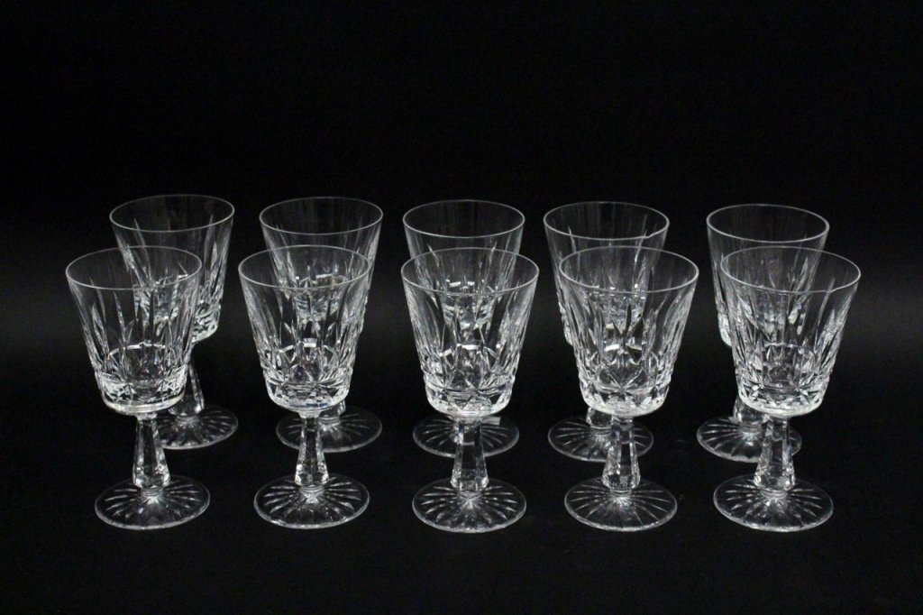 Set of Ten Waterford Crystal Footed Goblets: Set of ten Waterford crystal footed goblets or ice tea glasses in Rosslare pattern. Three marked on circular foot "Waterford". Height 6.75". Diameter of top 3.4".