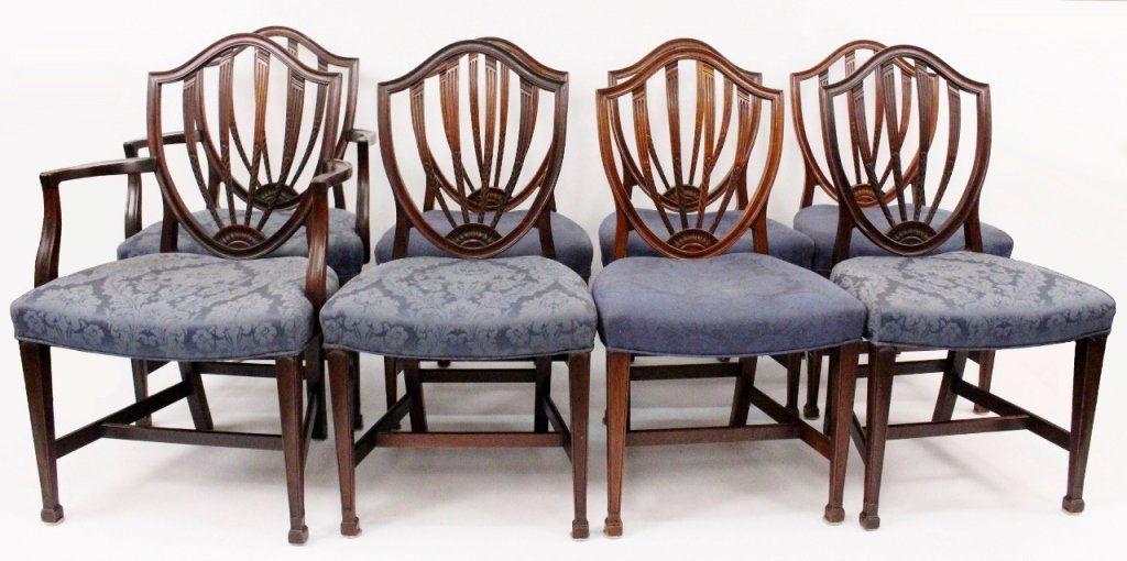 Set of 8 Hepplewhite Style Sheild Back Side Chairs: Eight Mid-20th C. Mahogany Hepplewhite style dining chairs with sheild backs, upholstered seats, and square tapered legs with "H" form stretchers. Two arm chairs and six side chairs. 38"H x 24"W acros