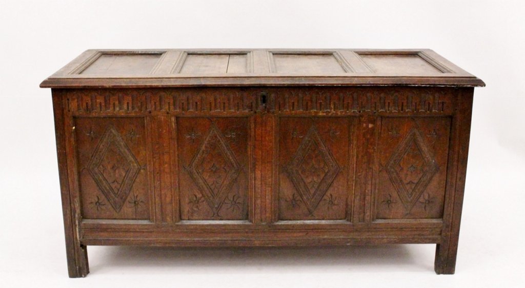 Large Carved Wood Blanket Chest, Circa 1860s: 19th century. Carved wood blanket chest of standard rectangular form with paneled hinged lid at top. Top opens to reveal storage within. Front, side and back panel with carved diamond, floral and arch