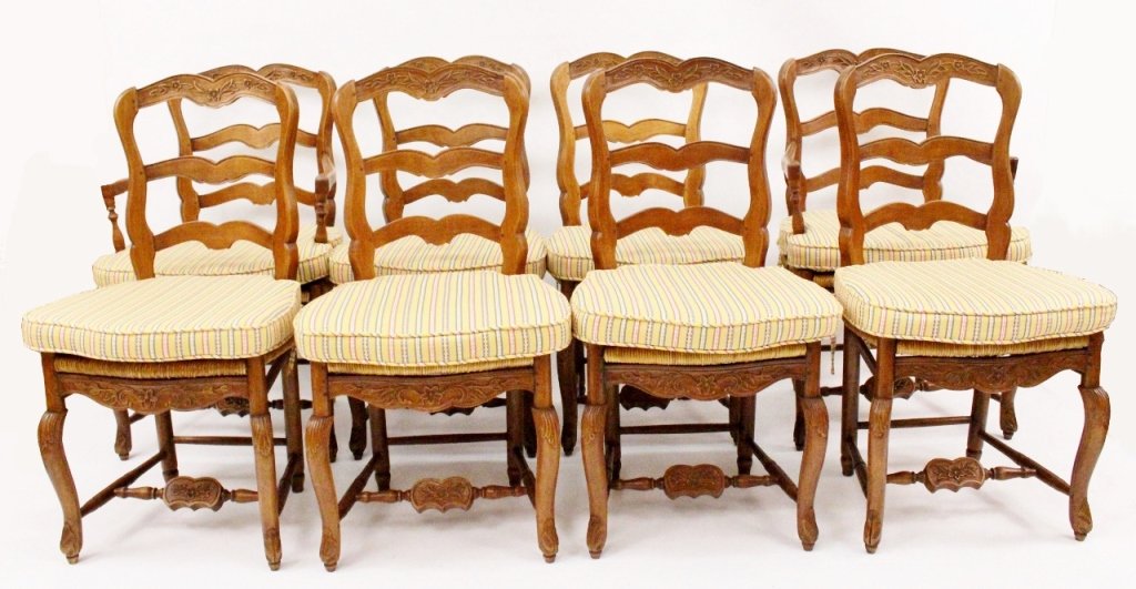 Set of 8 Ladderback Chairs w/Rush Seats: Pierre Deux, 20th century. Set of eight French provincial style chairs (two armchairs, six side chairs) composed of a fruitwood frame with ladder back slats decorated with flowers above rush seats. Ch