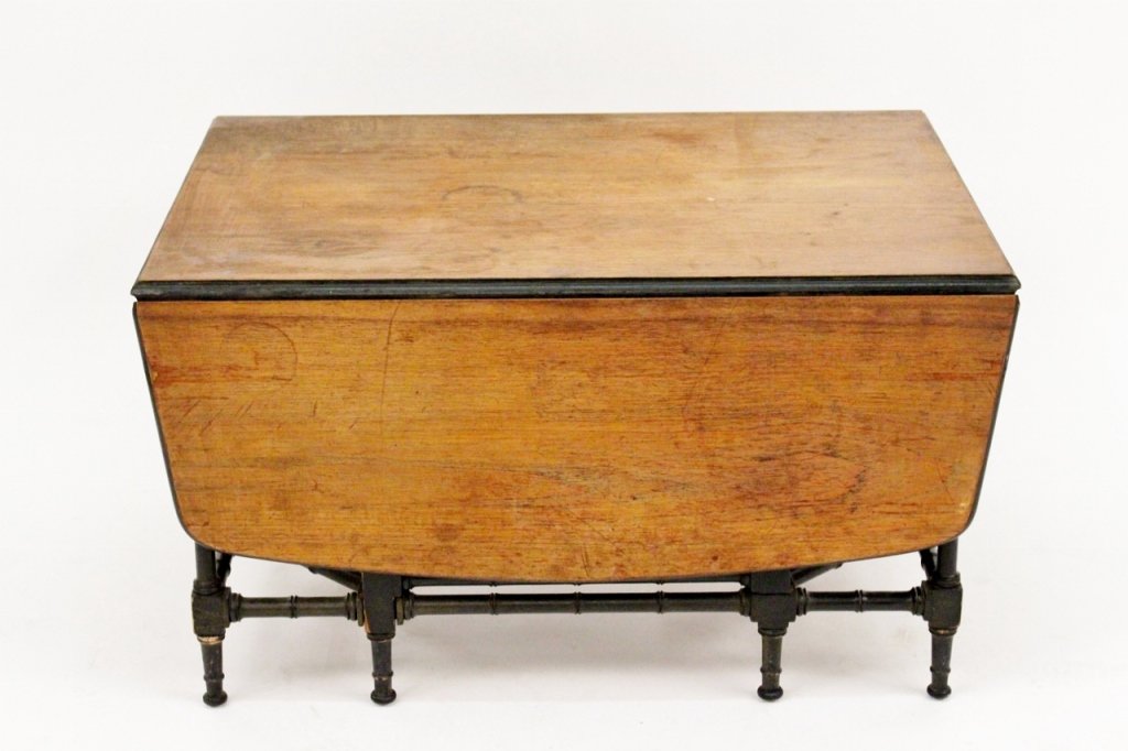 Mid 20th C. Drop Leaf Gate Leg Table: Mid 20th century. Drop leaf gate leg coffee table in mahogany and ebonized wood raised on bamboo turned legs and stretchers. Height 16.25", width 29", depth 21.25" (with leaves down).
