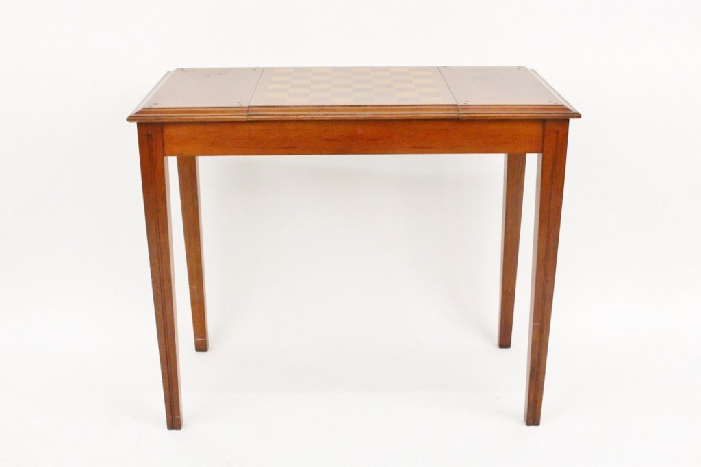 Flip Top Game Table: Late 19th/Early 20th century. Flip top game table of rectangular form and composed of mahogany wood. Rectangular top with center flip top panel (top with chess board, opposite side with inset leather