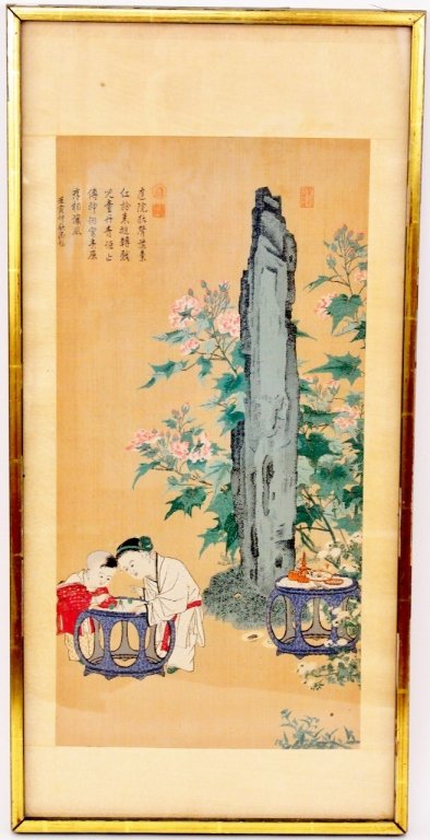 Chinese Silk Embroidery Figural Textile Panel: Chinese, 20th century. Textile panel with silk embroidery of two children playing with objects on a blue table in an outdoor setting marked with tall grey rock surrounded by pink peonies on sand color