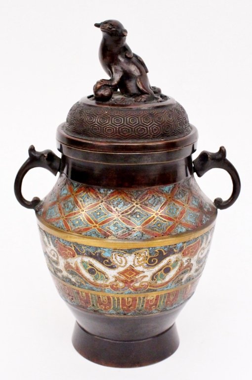 Oriental Champleve Enamel Censer: Oriental champleve enamel and bronze censer with hexagonal diaper patterned banding on lid below piercing and seated foo dog finial. Lower portion with two handles on neck with diamond motif champleve