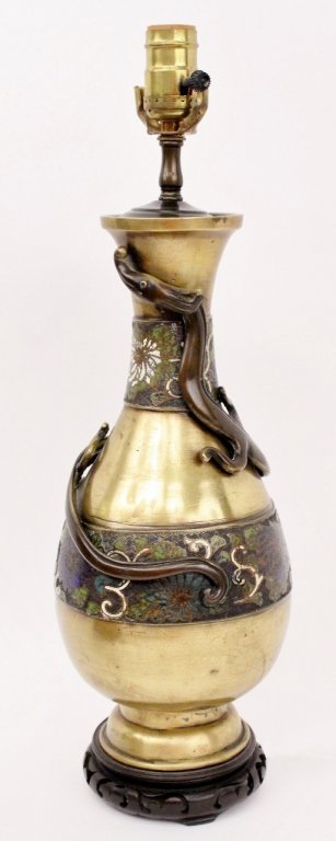 Oriental Champleve Table Lamp: Asian, 20th century. Table lamp with white and blue floral motif champleve bands on body and neck of metal footed vase. Exterior with dragon coiled around body further raised on circular bat motif pie
