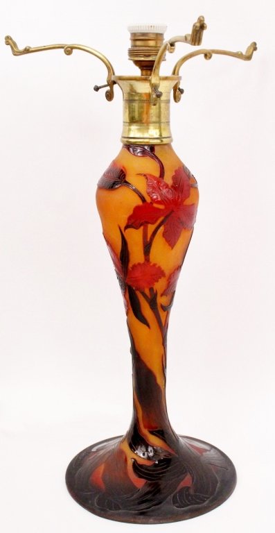 French D'Argental Cameo Art Glass Lamp: French, Early 20th century. D'Argental cameo art glass table lamp with floral motif in dark shades of brown, crimson red, and violet cut to amber yellow. Electrified, missing shade. Signed on large ro