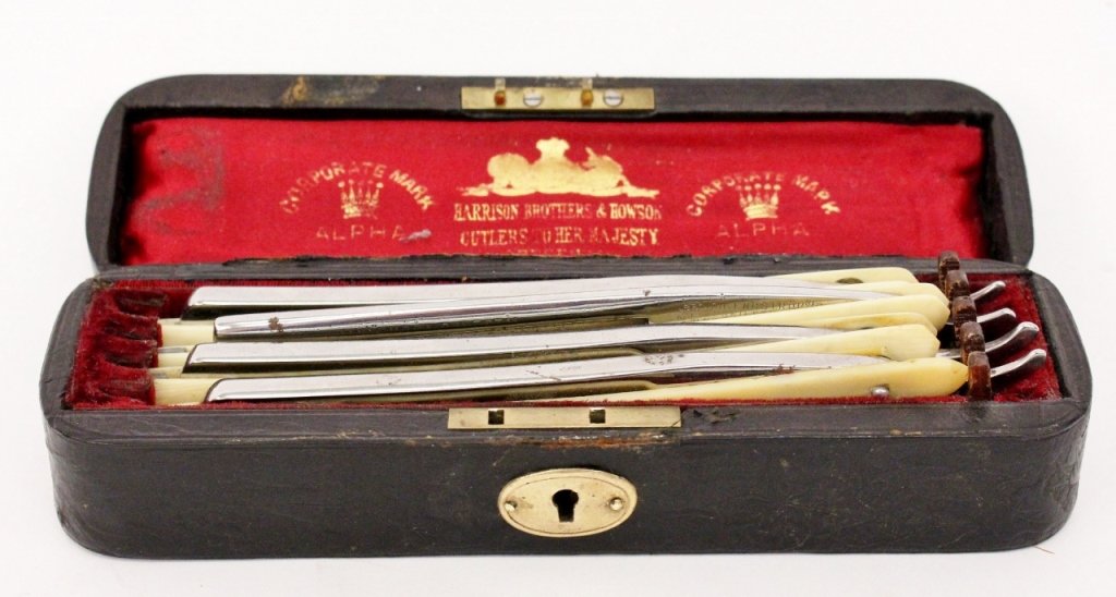 Harrison Brothers & Howson Ivory Handled Razors: English, Late 19th/Early 20th century. Harrison Brothers & Howson set of four handed men's razors, each marked with maker on blade and contained in a leather oblong fitted case with interior that read