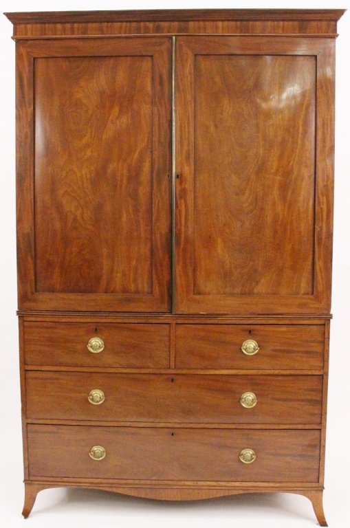 Mahogany Armoire Cabinet: First quarter of 20th century. Mahogany wood armoire storage cabinet with two hinged doors under rectangular cornice that open to reveal five pull out drawer/shelves below a brass rod. Two part armoir