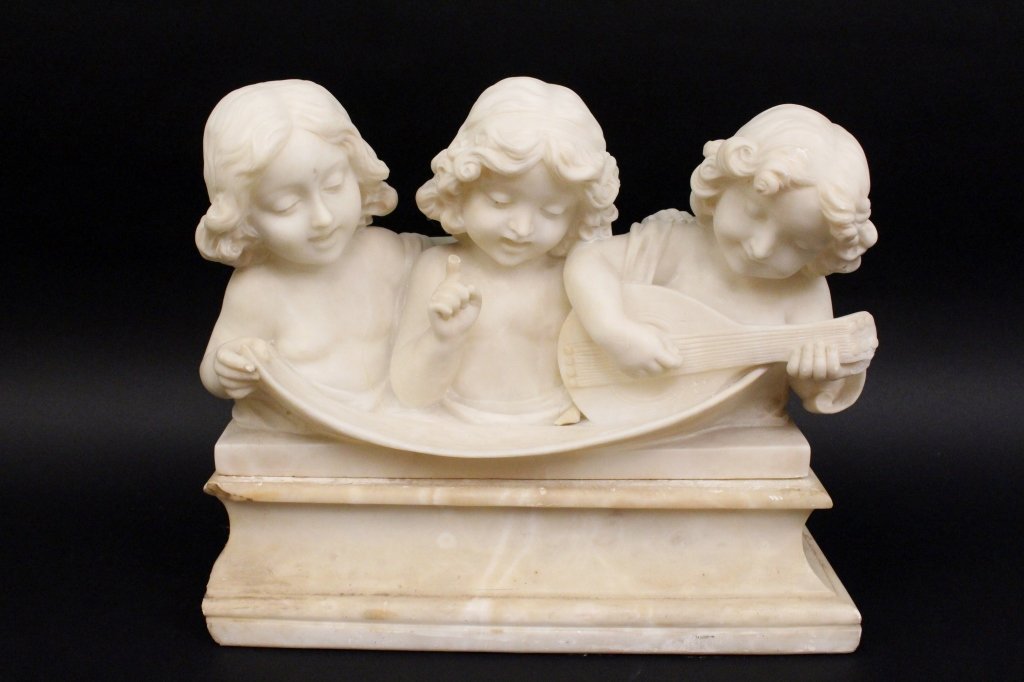 Adolfo Cipriani Sculpture of 3 Musical Putti: Adolfo Cipriani (Italian active 1880-1930). Carved alabaster figural sculpture depicting three nude putti figures singing from a scroll of music draped in front of them. Figure on the right playing a
