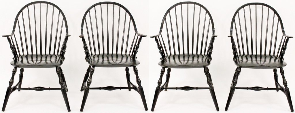 Set of 4 Kittinger Painted Windsor Chairs: Set of four Kittinger "Williamsburg" dark military green painted wood windsor arm chairs with rounded backs supported by spindle back. Arms, legs, and cross support composed of turned wood shafts. Mar
