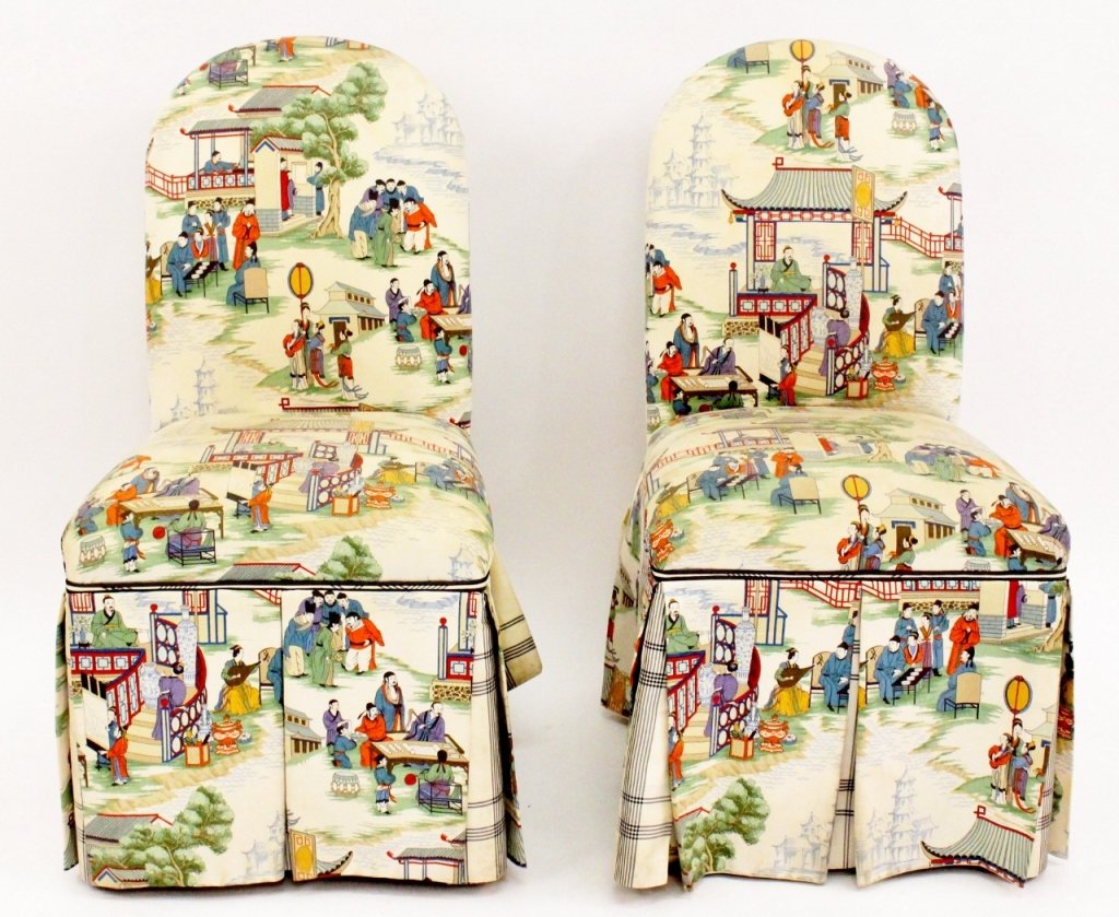 Pair of Chinoiserie Upholsted Slipper Chairs: 20th century. Pair of slipper chairs with rounded back and pleated skirt over fabric covered legs custom upholstered in chinoiserie figural motif fabric with blue and white plaid accent fabric on skir
