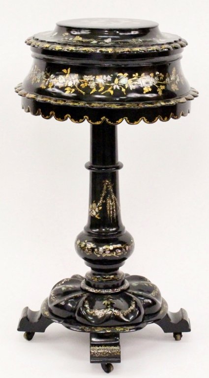 Victorian Papier Mache MOP Inlaid Sewing Stand: Mid 19th century. Victorian papier mache mother of pearl inlaid sewing stand with round hinged top decorated with flowers and leaves with scalloped edge that lifts to reveal removable circular pink ve