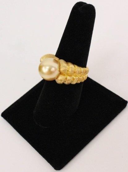 18k Yellow Gold Designer Ring by Henry Dunay: Circa 1970-1980 18k yellow gold designer ring by Henry Dunay with one 11.1mm golden South Sea pearl. Fine AAA Luster. Gram weight: 20.1 grams. US ring size 8.