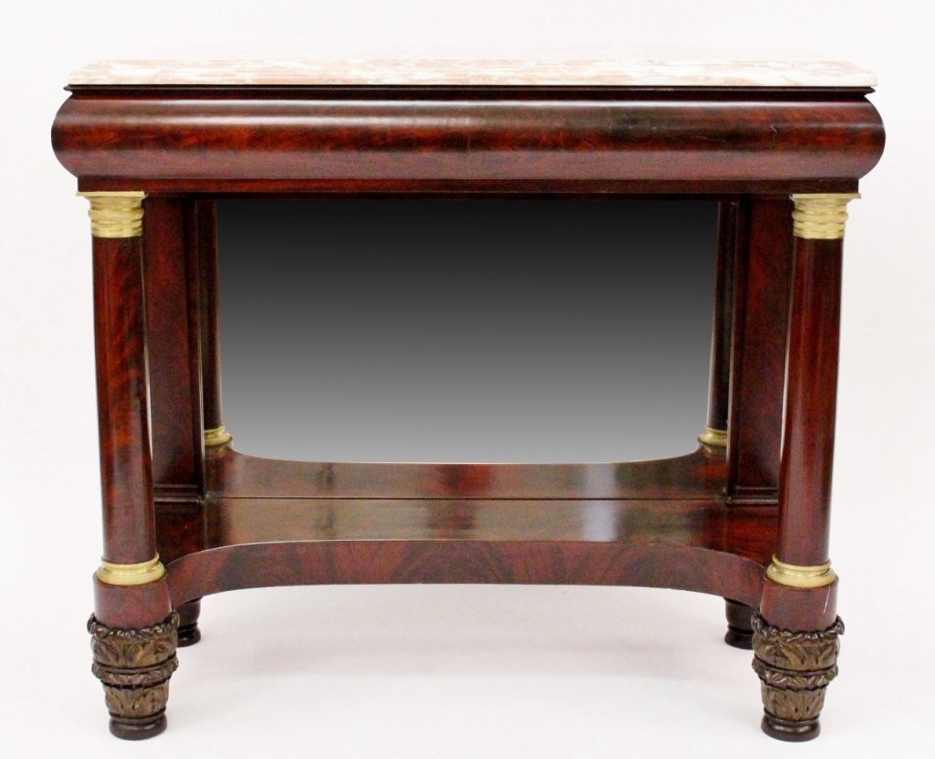 Empire Marble Top Mahogany Pier Table: American (likely New York), 19th century. Empire (circa 1820) pink marble top above out curved frieze form apron over a framed mirror at back which reflects the curved lower shelf flanked at front by 