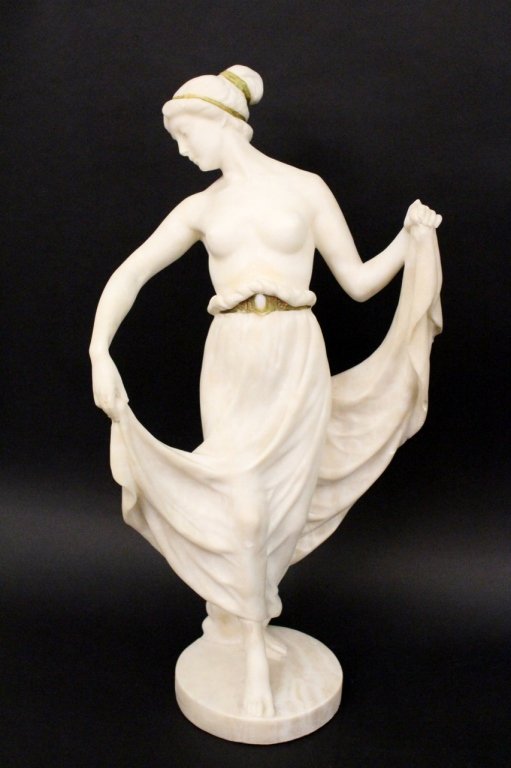 Valentin Carved Alabaster Sculpture of Woman: Max Valentin (German, b. 1875). Carved alabaster sculpture of a woman wearing a long skirt with a gilt accented and opal cabochon belt. Woman with additional gilt banding in her hair, exposed breast a