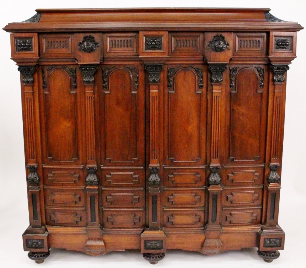 Large Rosewood & Ebonized Wood Cabinet: French, 19th century. Mahogany and ebonized wood cabinet with two pull out drawers at top above two hinged doors that open to reveal four pull out drawers at top with locking escutcheons above four dr