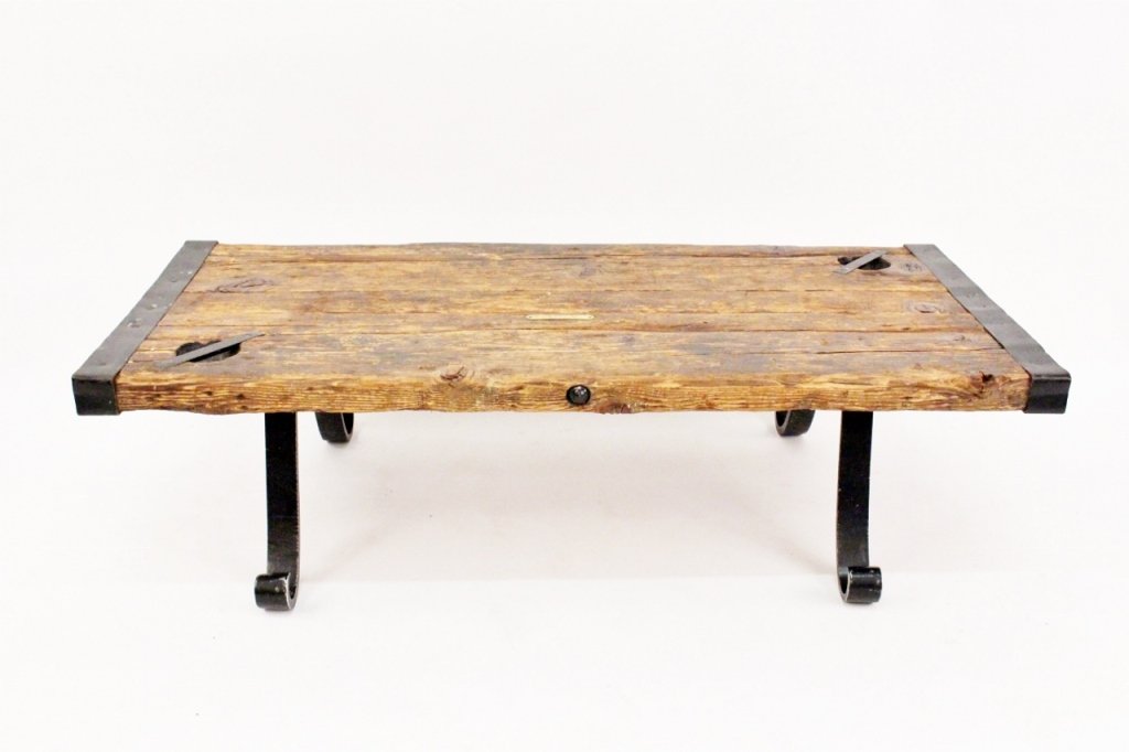 World War II Liberty Ship Hatch Cover Coffee Table: American, first half of 20th century. Coffee table of rectangular form with pine wood and black iron top constructed from World War II Liberty Ship Hatch Cover raised on black painted metal legs with