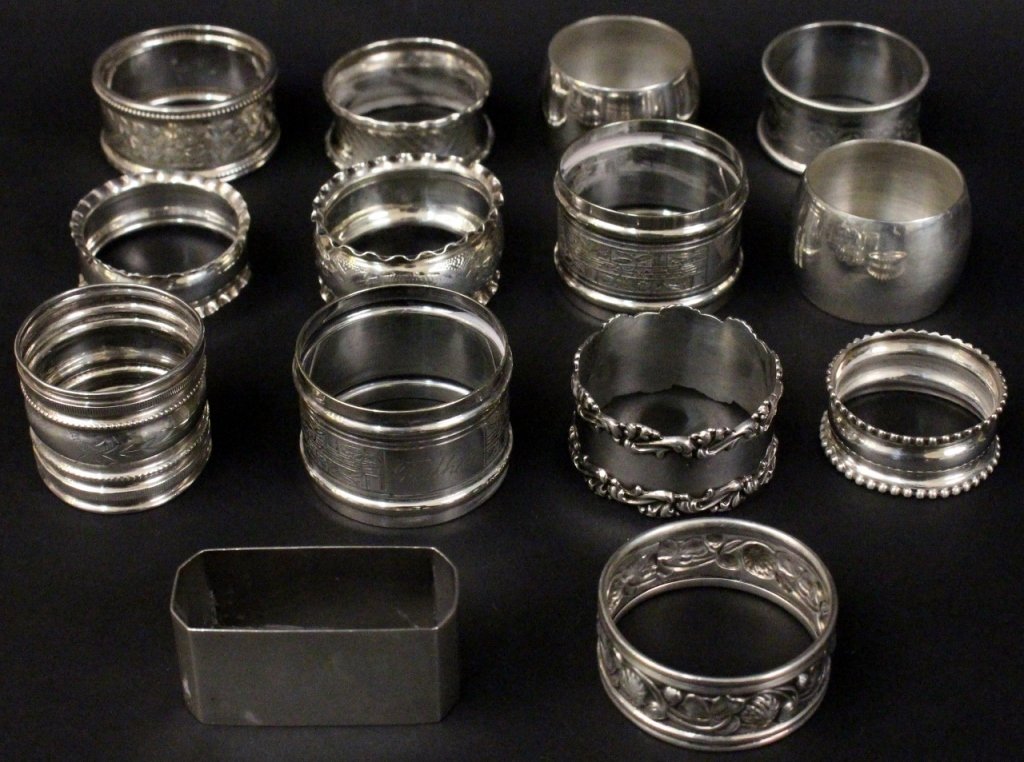 Group of 14 Sterling & Plated Napkin Rings: English/American, 19th/20th century. Group of fourteen assorted napkin rings (eight marked for sterling silver). Two pairs with matching patterns, all other from various makers and in variety of patte